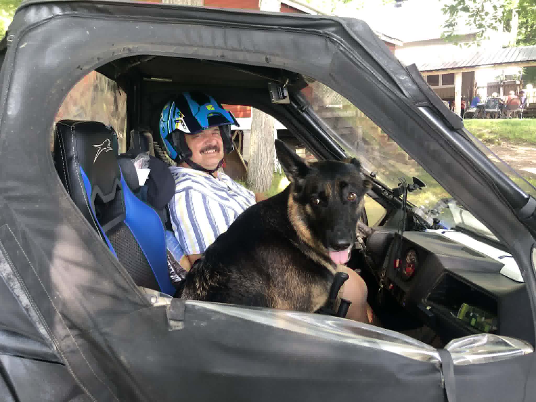 Chris and dog in the RZR