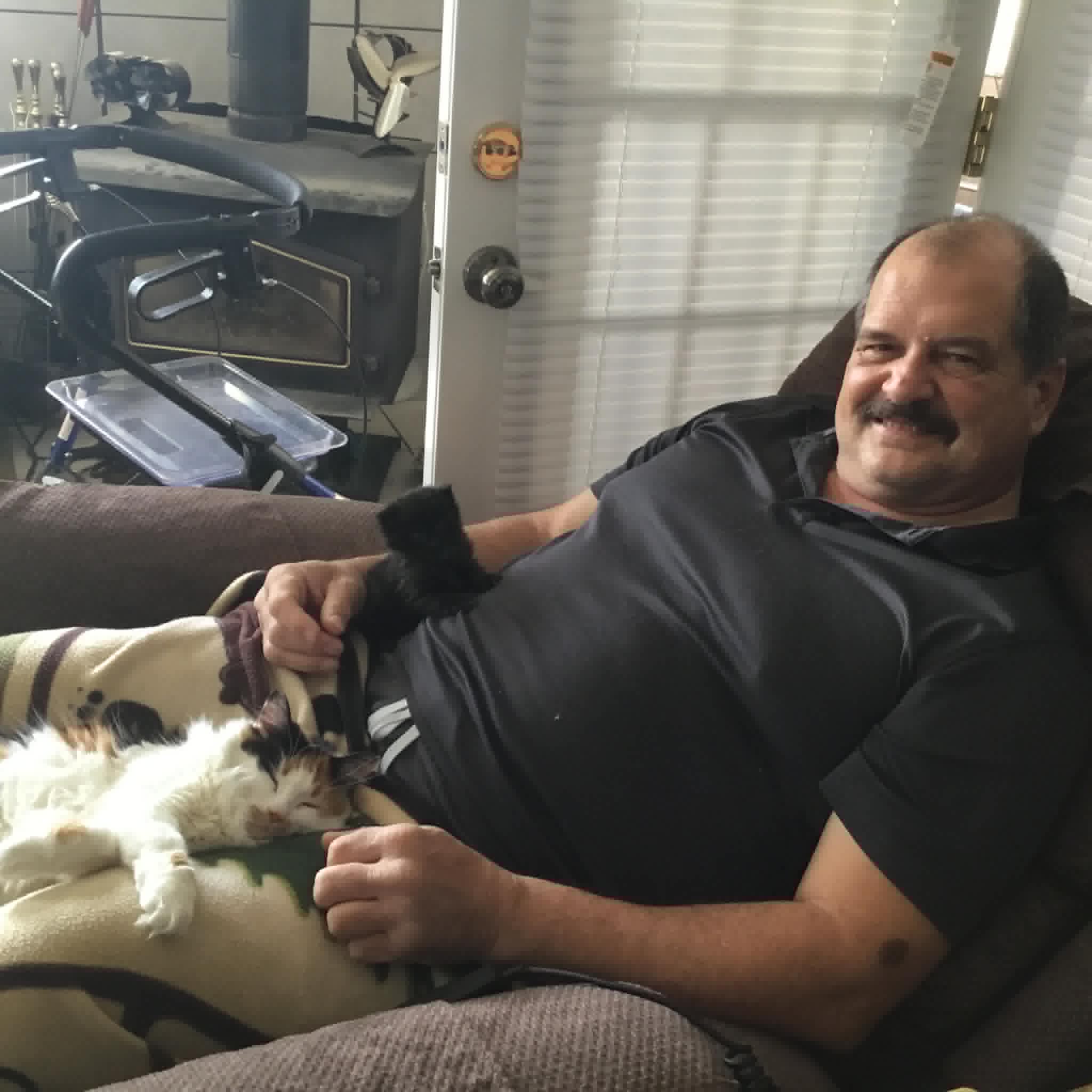 Chris with cat on the couch