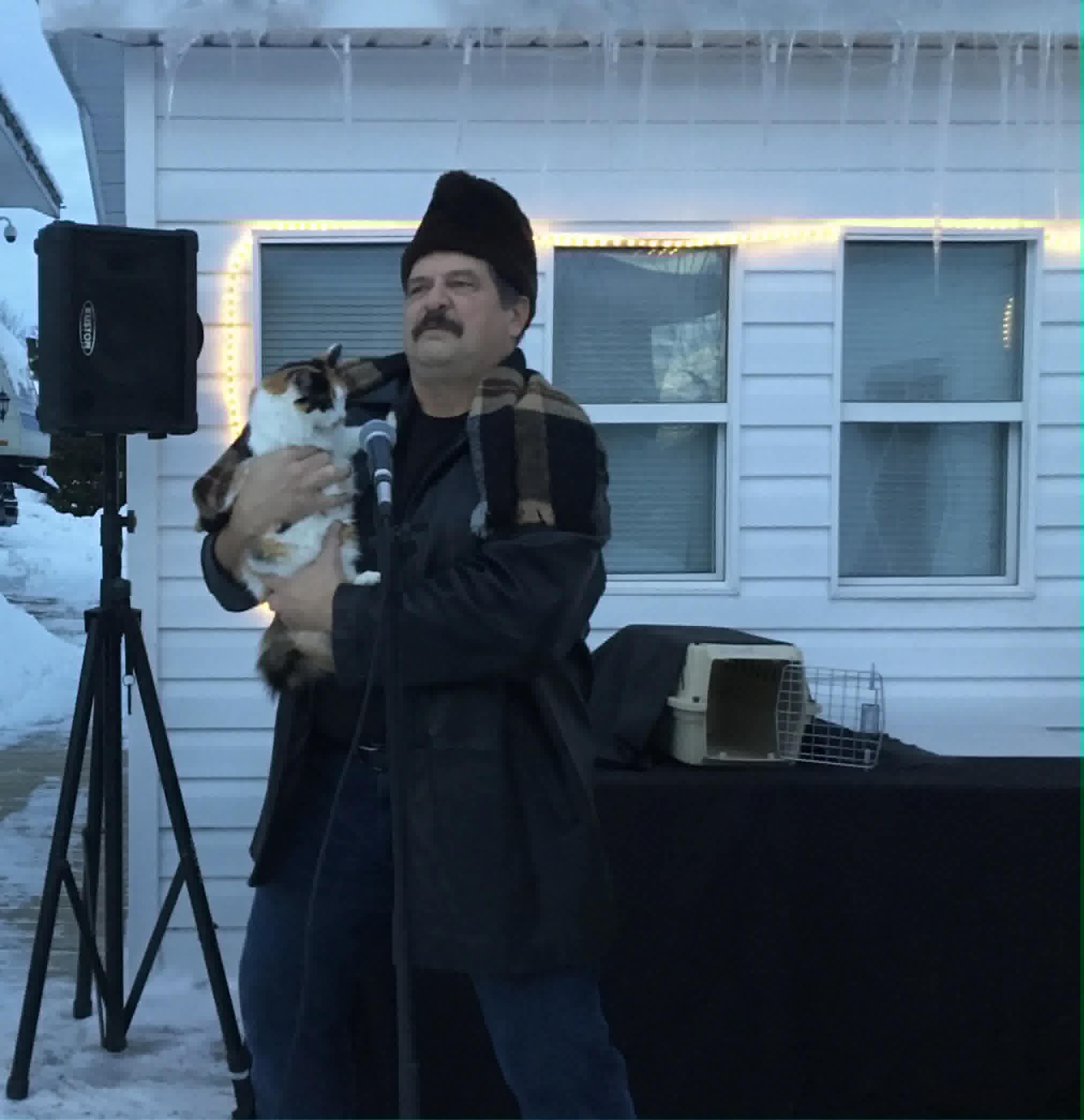 Chris performing with his cat in winter